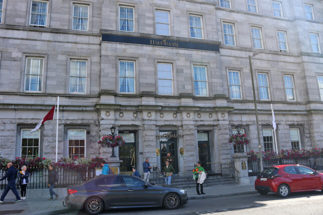 a building with people walking in front of it