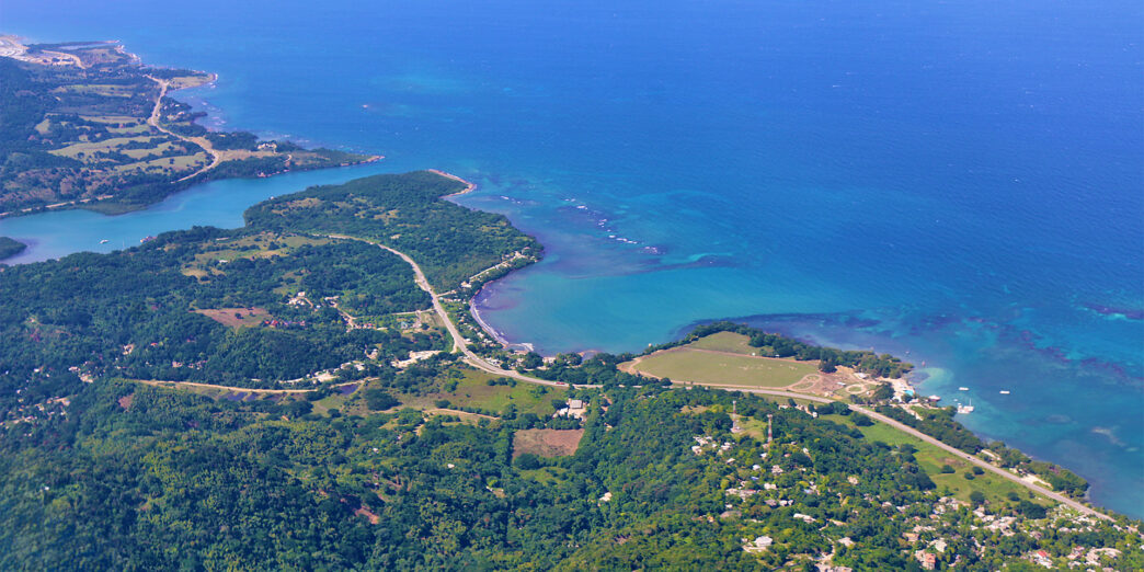 an aerial view of a body of water and land