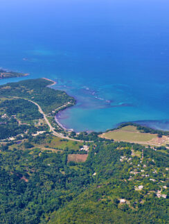 an aerial view of a body of water and land
