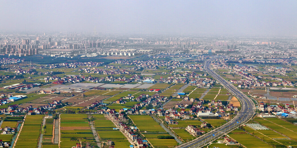 a city with a road and buildings
