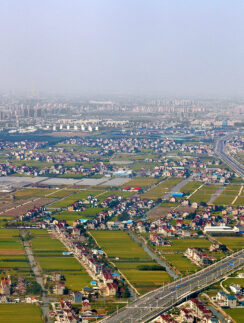 a city with a road and buildings