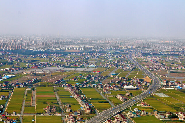 a city with a road and buildings