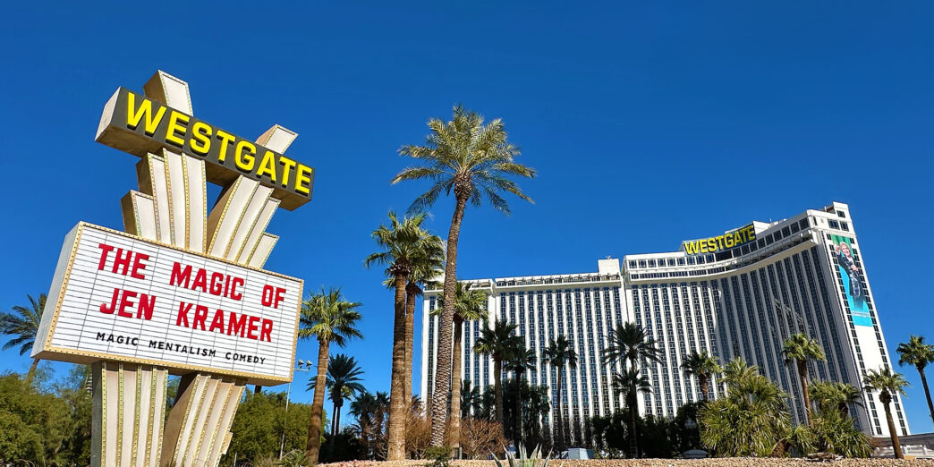 a large sign in front of a hotel