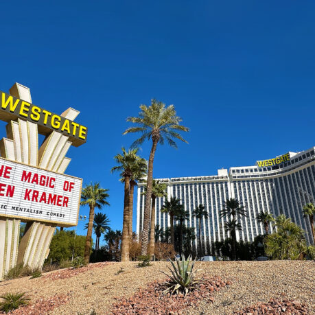 a large sign in front of a hotel