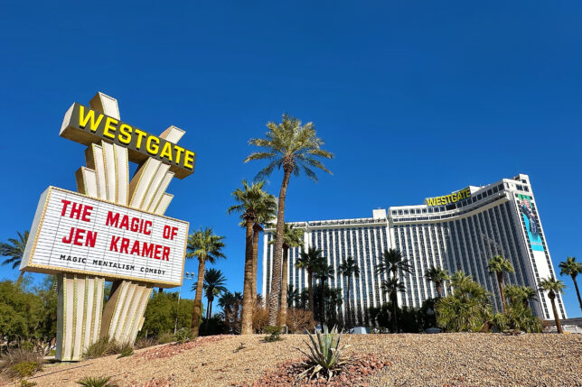 a large sign in front of a hotel