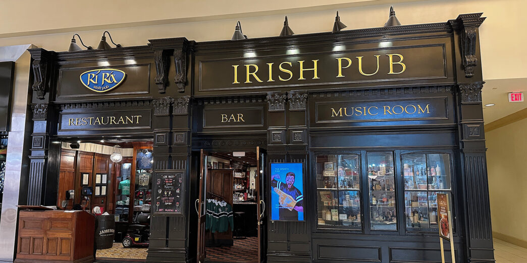 a black store front with gold text