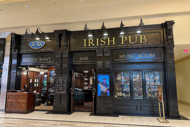 a black store front with gold text