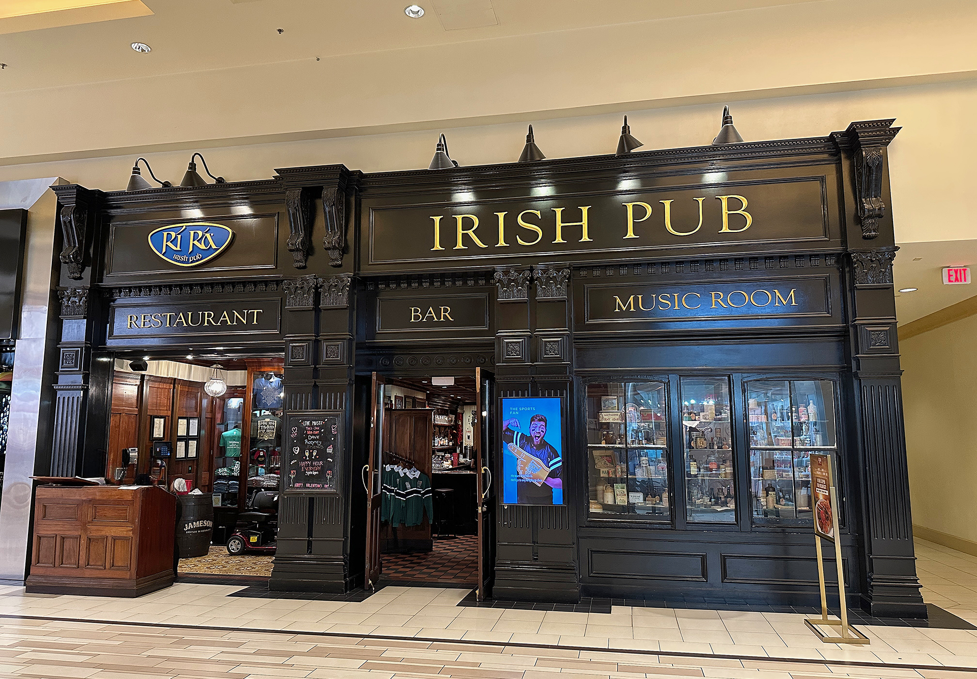 a black store front with gold text