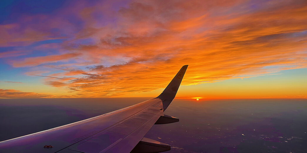 an airplane wing in the sky