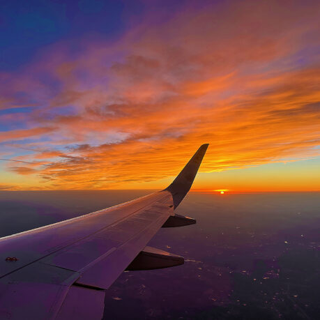 an airplane wing in the sky
