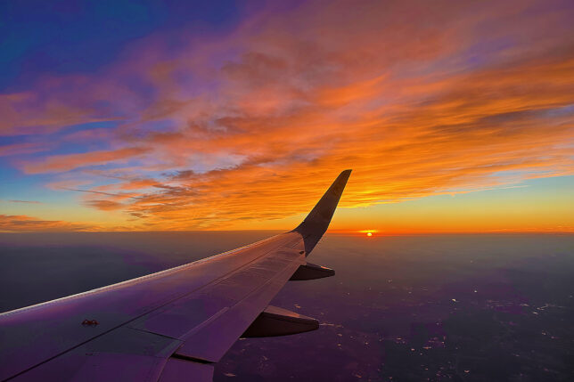 an airplane wing in the sky
