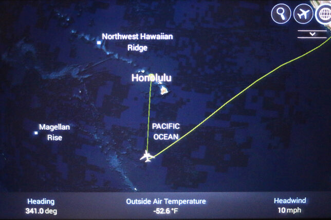 a map of the island with a plane flying