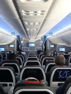 a group of people sitting in an airplane