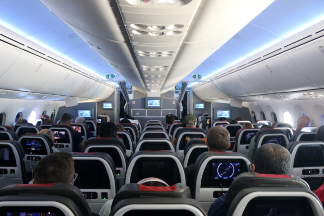 a group of people sitting in an airplane