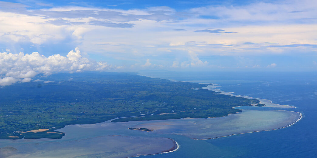 an aerial view of a body of water and land