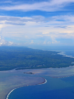 an aerial view of a body of water and land