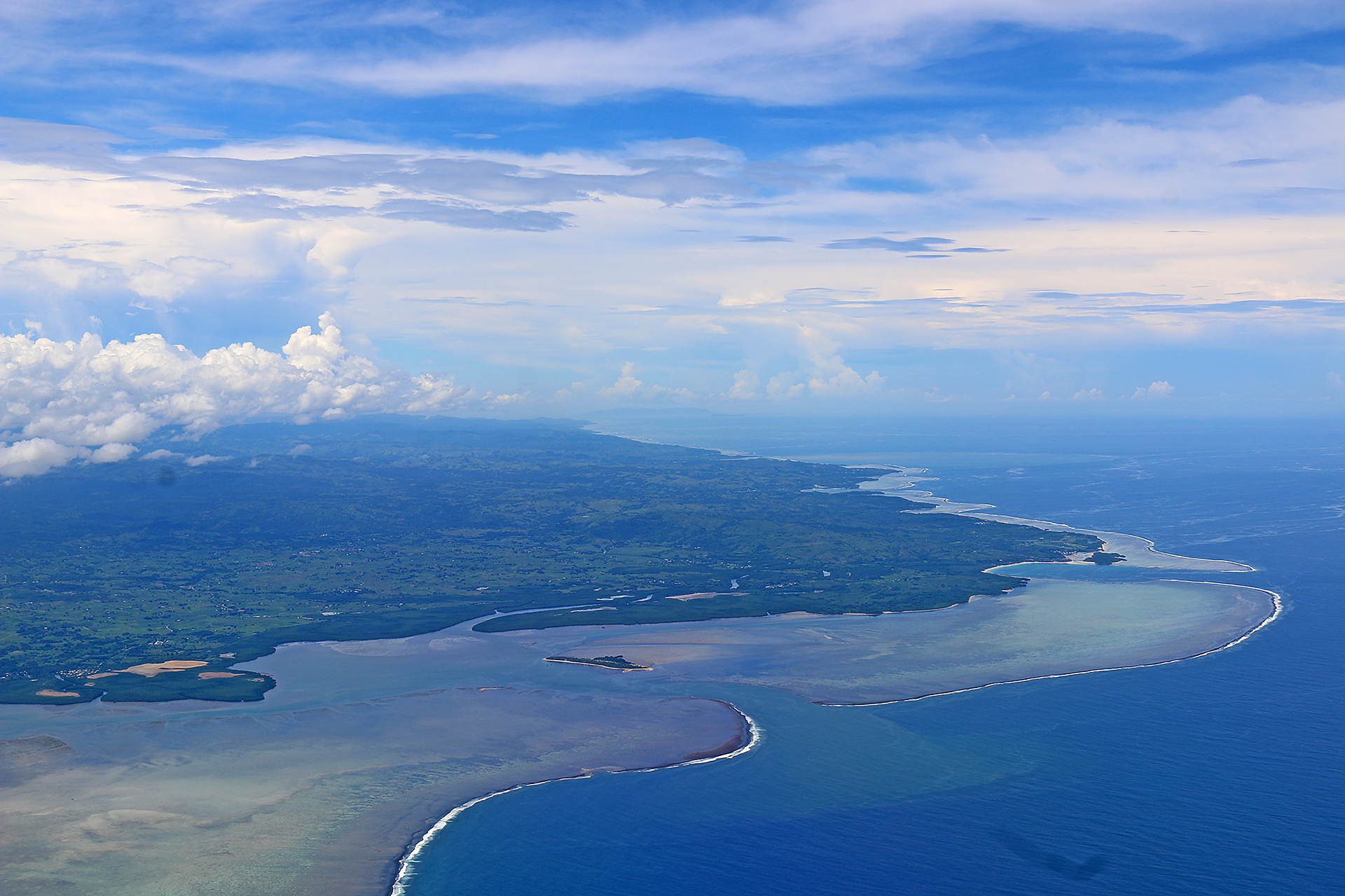 an aerial view of a body of water and land