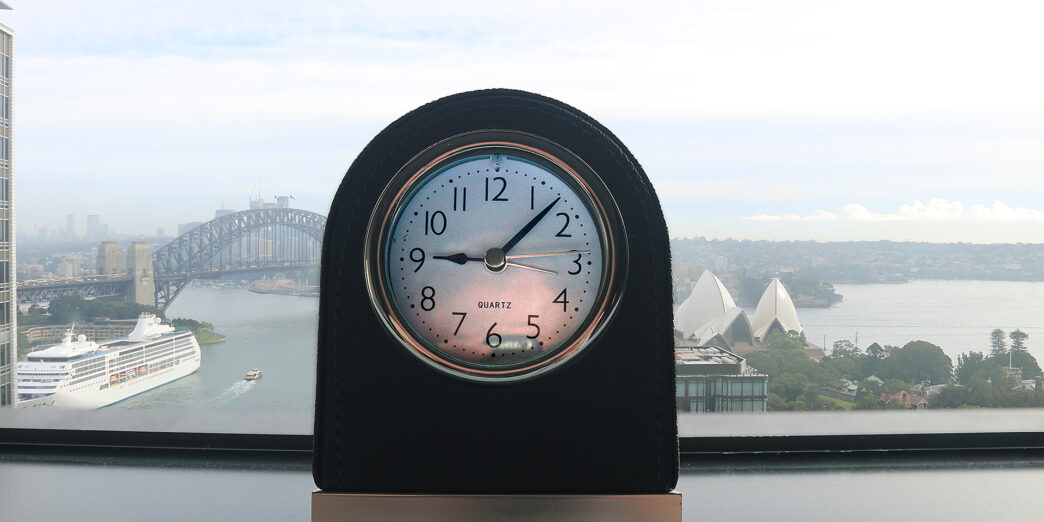 a clock on a window sill