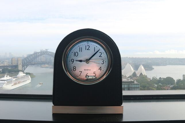 a clock on a window sill