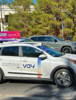 a white car parked on the side of a road