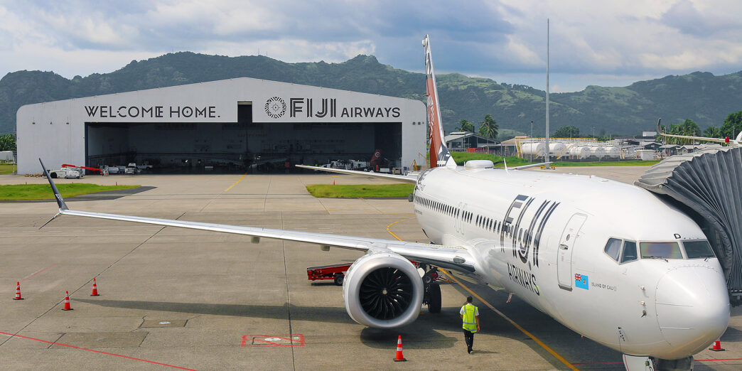 a white airplane on the tarmac