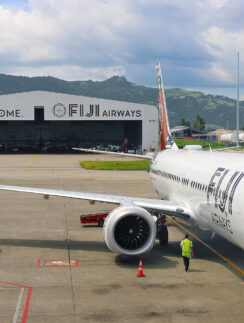 a white airplane on the tarmac