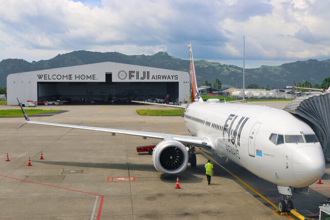a white airplane on the tarmac