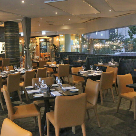 a restaurant with tables and chairs