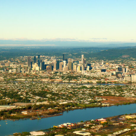 a city with a river and a city in the distance
