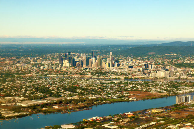 a city with a river and a city in the distance