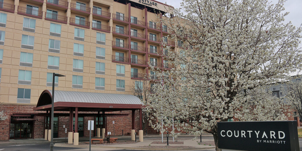 a building with a tree in front of it