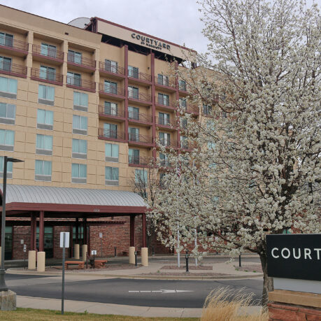 a building with a tree in front of it