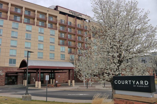 a building with a tree in front of it