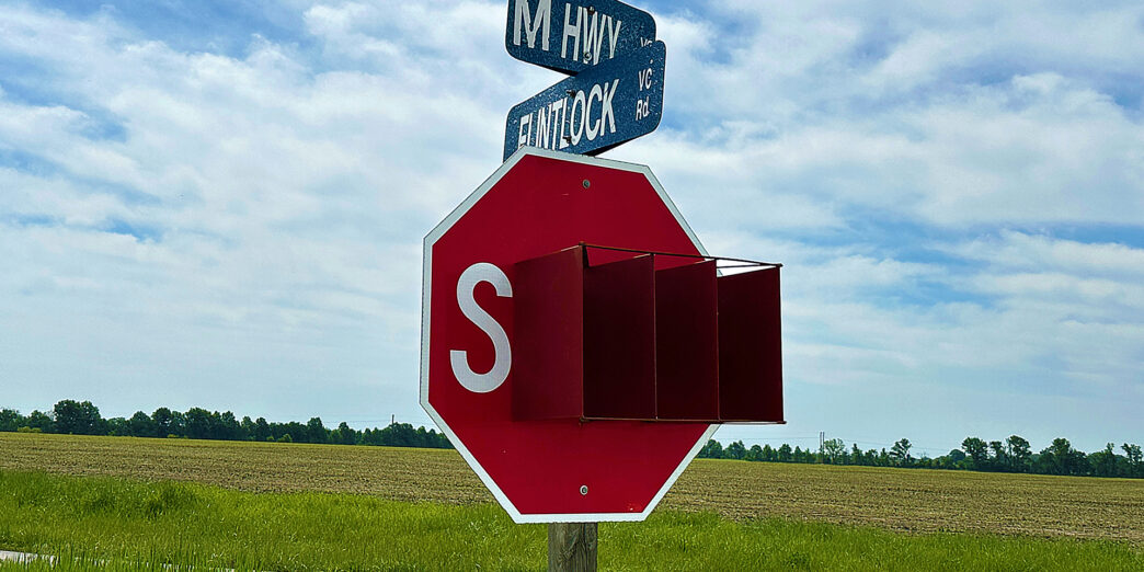 a stop sign with street signs on it