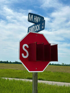 a stop sign with street signs on it