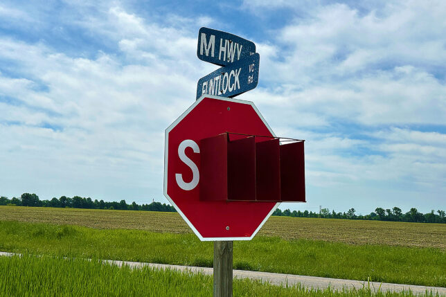 a stop sign with street signs on it