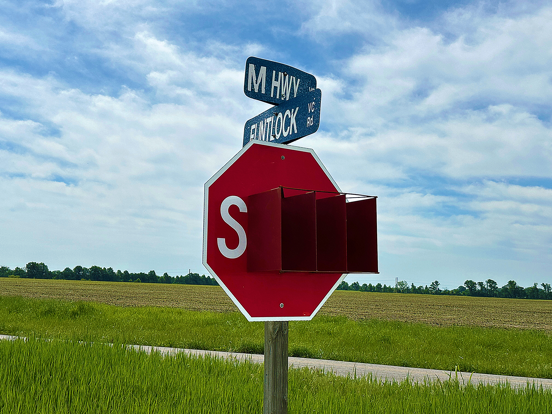 a stop sign with street signs on it