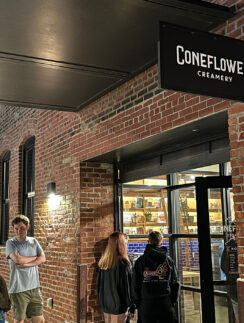 a group of people standing outside a store