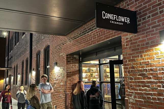 a group of people standing outside a store