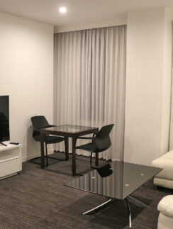 a room with a tv and couches