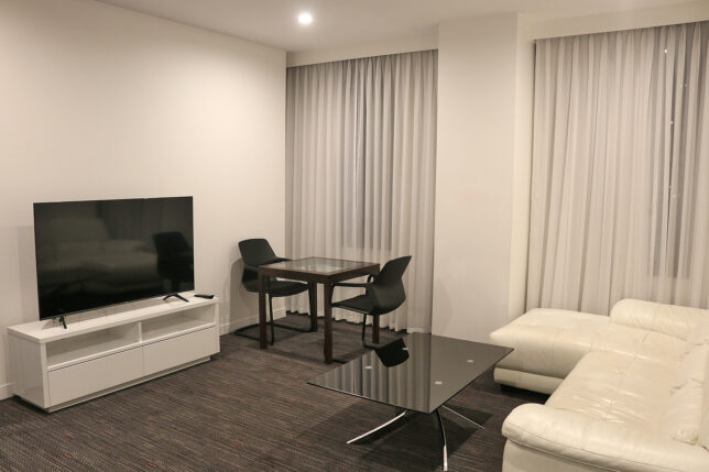 a room with a tv and couches