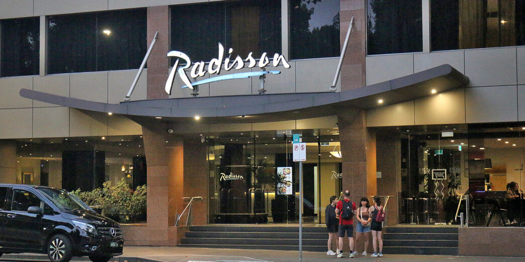 a group of people standing outside of a building