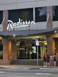 a group of people standing outside of a building