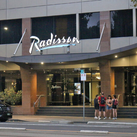 a group of people standing outside of a building