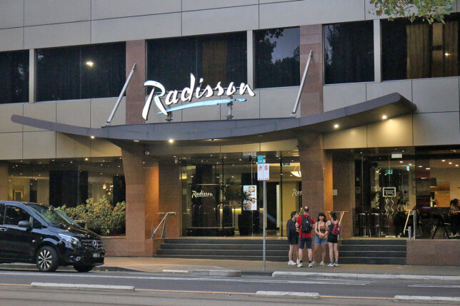 a group of people standing outside of a building