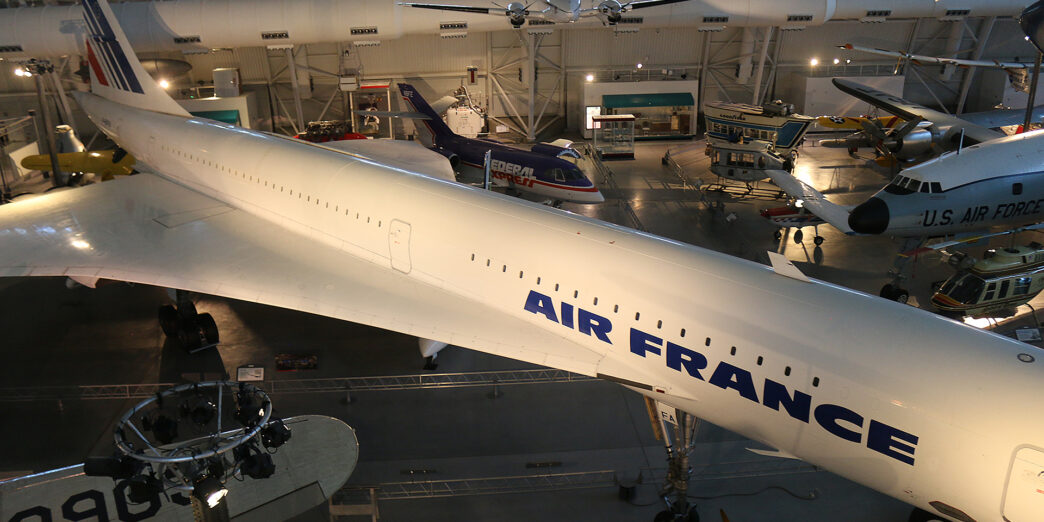 a large white airplane in a hangar