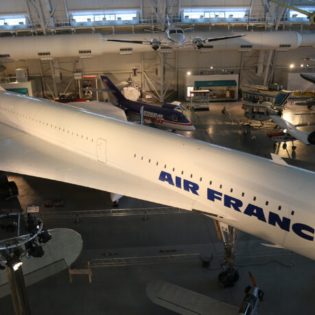 a large white airplane in a hangar