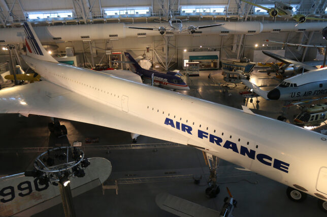 a large white airplane in a hangar