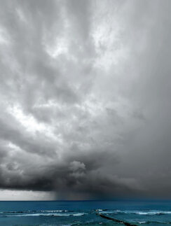 a storm clouds over the ocean