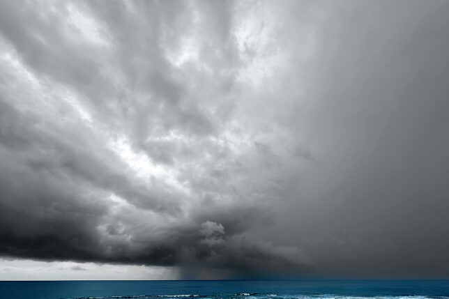 a storm clouds over the ocean